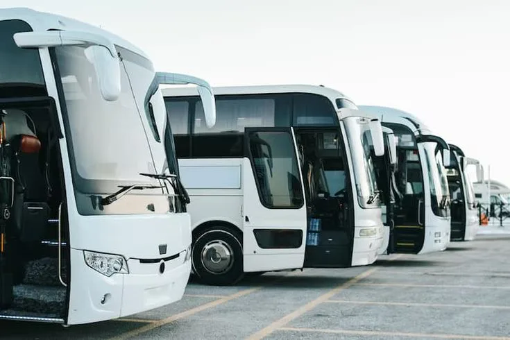 A row of coaches parked at a bus operator's depot